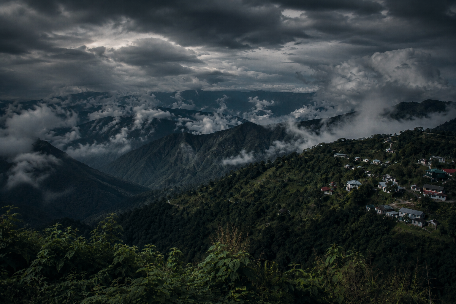 Clouds rolling through forested Northeast Indian hills at dusk